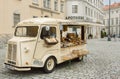 Vintage car with trader's showcase, food and cosmetics for sale outdoor