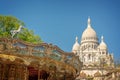 Vintage carousel and the Basilica of the Sacred Heart in Montmartre Paris France Royalty Free Stock Photo