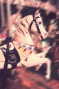 Vintage carousel horse. Antique style carved wood on an old amusement merry go round motion blur Royalty Free Stock Photo