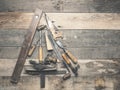 Vintage carpenter tools as a Christmas tree on an old rustic wooden table Royalty Free Stock Photo