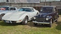 Vintage cars Fiat 500 Topolino and Chevrolet Corvette C3 Royalty Free Stock Photo