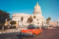 Vintage cars next to the iconic Capitol building in Havana Royalty Free Stock Photo