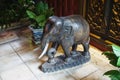 Vintage carved wooden elephant with real ivory tusks in Bangkok Thailand