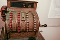 Vintage cash register with round buttons with numbers in a sepia tone Royalty Free Stock Photo