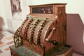 Vintage cash register with round buttons with numbers in a sepia tone side view Royalty Free Stock Photo