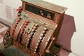 Vintage cash register with round buttons with numbers in a sepia tone top down view Royalty Free Stock Photo