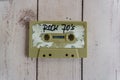 Vintage cassette tape isolated on wooden background with sign reading rock 70s Royalty Free Stock Photo