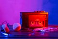 Vintage cassette tape player in neon light. 80s - 90s advertisement style. Disco party nostalgy concept Royalty Free Stock Photo