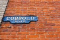 A vintage cast iron street sign, one of the older types of sign in the UK labeling Cobbold Road in Felixstowe town center Royalty Free Stock Photo