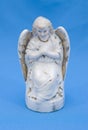 Vintage ceramic angel on a light blue background Royalty Free Stock Photo