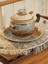 Vintage ceramic saucer and sugar bowl on cloth serving tray