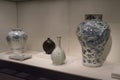 Vintage ceramic vase and statue of Chinese art on display in museum. Royalty Free Stock Photo