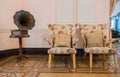 Vintage chair and gramophone in the classic room Royalty Free Stock Photo