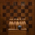 Vintage chessboard and child`s wooden bowling set Royalty Free Stock Photo