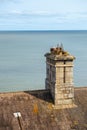 Vintage chimney pots by the blue sea Royalty Free Stock Photo