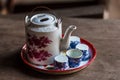 Vintage Chinese teapot and tea cups on wooden table. Royalty Free Stock Photo