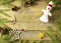 Vintage christmas background - old planked wood board with pine tree branch, pinecones and wooden, golden star, do-it Royalty Free Stock Photo