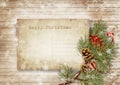 Vintage christmas card on wood background with branches and cones. Christmas greeting card with copy-space Royalty Free Stock Photo