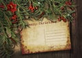 Vintage Christmas card on a wooden background with a nice garland. Royalty Free Stock Photo