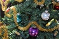 vintage Christmas decoration on an artificial tree, purple, siver and green