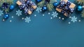 Vintage Christmas frame border. Flat lay fir three branches, blue balls and snowflakes over blue background. Top view, copy space Royalty Free Stock Photo