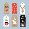Vintage Christmas gift tags set. Hand drawn labels with bunny, deer, polar bear, cup of coffee and winter flowers Royalty Free Stock Photo
