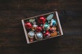 Vintage Christmas ornaments, antique retro Christmas glass baubles, balls in wooden box on rustic background. Old xmas Royalty Free Stock Photo