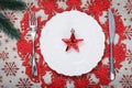 Vintage Christmas plate on holiday background with red star. Canvas background with red glitter snowflakes. Xmas card. Happy New Royalty Free Stock Photo