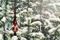 Vintage Christmas treetop on a living fir in a real winter snow-covered forest