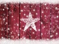 Christmas winter holiday snow star background with snowflakes on wooden texture with snow frame Royalty Free Stock Photo