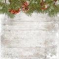 Vintage christmas wood background with branches, holly and cones. Christmas greeting card with copy-space Royalty Free Stock Photo