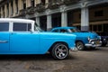 Vintage Chrysler next to old buildings in Havana