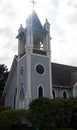 Vintage church building with cross backlit