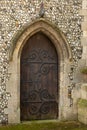 Vintage church wooden door in stone archway Royalty Free Stock Photo