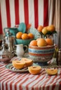 vintage circus kitchen setting with a cantaloupe displayed on a striped tablecloth surrounded by circus props Royalty Free Stock Photo