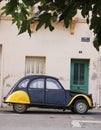 Vintage Citroen 2cv car parked on street in France Royalty Free Stock Photo