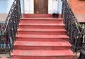 Vintage City steps in red in a busy part of town