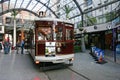 Vintage city tour tram, tramcar, tramway, trolley waiting at indoor tram stop at Cathedral Junction, Christchurch, New Zealand Royalty Free Stock Photo