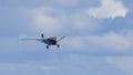 Vintage 1931 Civilian Coupe 02 G-ABNT aircraft in flight against blue sky and clouds.