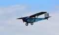 Vintage 1931 Civilian Coupe 02 G-ABNT aircraft in flight with blue sky and clouds.