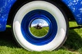 Vintage classic American blue car wheel Royalty Free Stock Photo