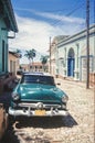 Vintage classic american car parked on a street of Old Havana. Cuba Royalty Free Stock Photo