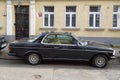 Vintage veteran old classic black car Mercedes Benz 280 CE two doors sedan parked
