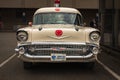 Vintage Classic car 1957 Chevy Ambulance Station wagon, Ambulance Service parked on a street. Old Ambulance car