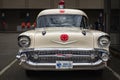 Vintage Classic car 1957 Chevy Ambulance Station wagon, Ambulance Service parked on a street. Old Ambulance car