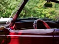 Vintage classic car dashboard and steering wheel medium shot Royalty Free Stock Photo