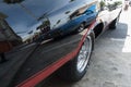 Vintage classic car with reflection of the street on its surface