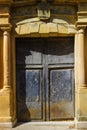 Vintage classic double-sided door in a red brick wall under a tiled roof