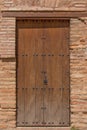 Vintage classic double-sided door in a red brick wall under a tiled roof