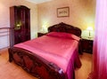 Vintage classic hotel purple bedroom interior Royalty Free Stock Photo